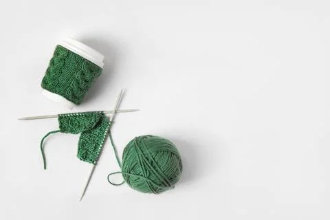 Cup coffee and wool with knitting needles Stock Photos