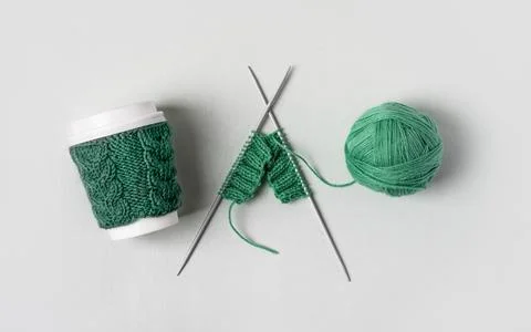 Cup coffee and wool with knitting needles Stock Photos