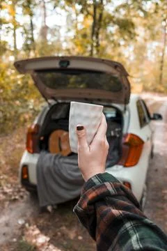 Cup of coffee on the background of the car. Stock Photos