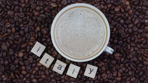 Cup with coffee on a background of coffee beans with the word Italy outlined Stock Footage 155469021