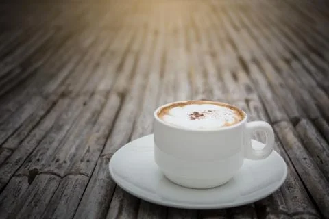 Cup of coffee on bamboo table. Foto stock