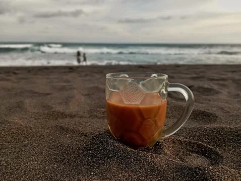 A cup of coffee by the beach Stock Photos