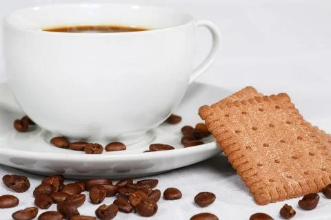 Cup of coffee, beans and biscuits Stock Photos