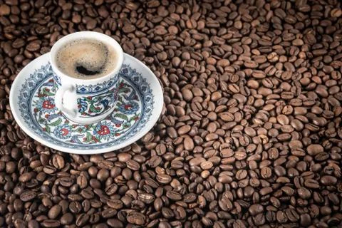 Cup of coffee beans background Stock Photos