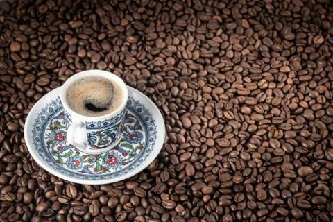 Cup of coffee beans background Stock Photos
