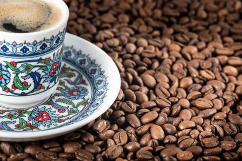Cup of coffee beans background Stock Photos