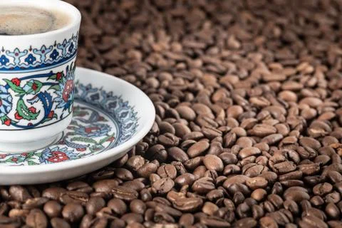 Cup of coffee beans background Stock Photos