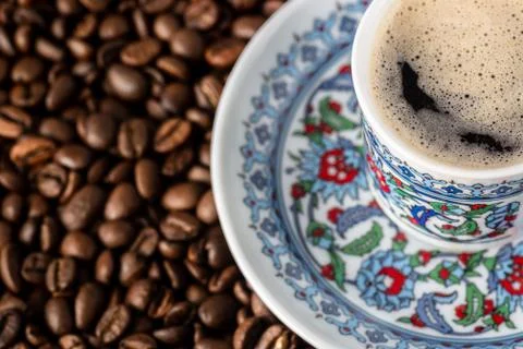 Cup of coffee beans background Stock Photos