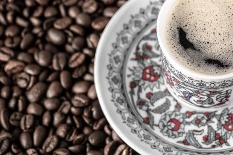 Cup of coffee beans background Stock Photos