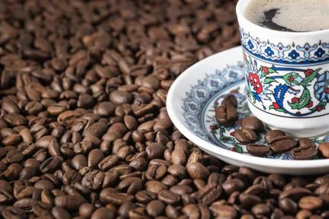 Cup of coffee beans background Stock Photos