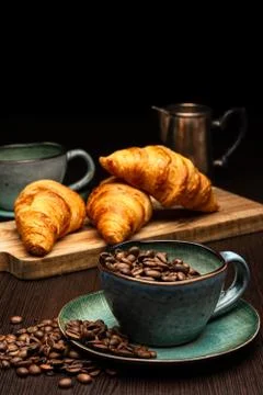 Cup with coffee beans on a black background Stock Photos