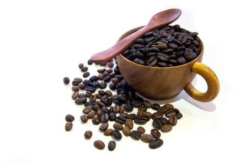 Cup with coffee beans isolated on white background. Stock Photos