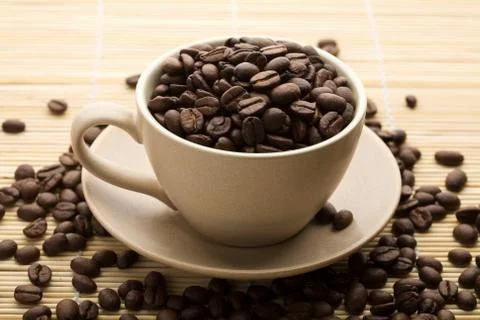 Cup of coffee beans Stock Photos