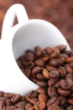 Cup in coffee beans 스톡 사진