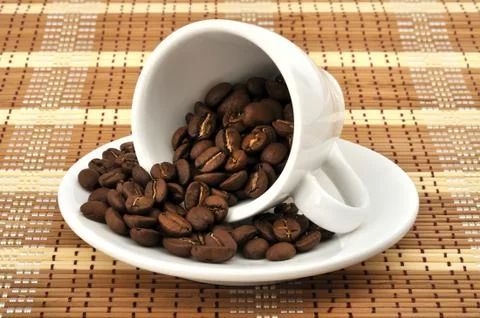 Cup with coffee beans Stock Photos