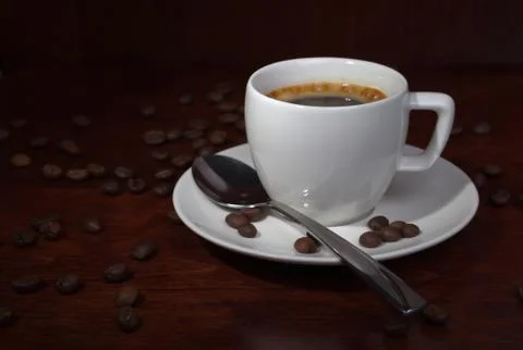 Cup with coffee beans Stock Photos