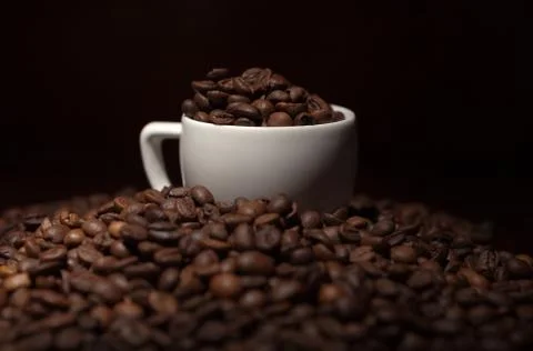 Cup with coffee beans Stock Photos