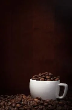 Cup with coffee beans Stock Photos
