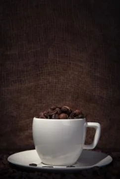 Cup with coffee beans Stock Photos