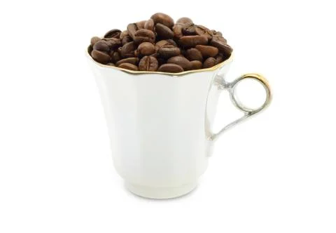 Cup with coffee beans Stock Photos