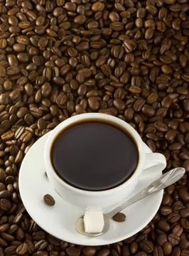 Cup of coffee at beans Stock Photos