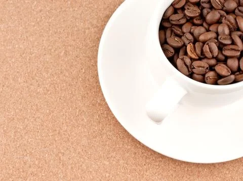 Cup with coffee beans Stock Photos