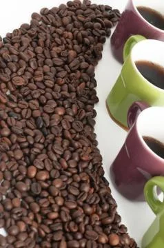 Cup of coffee with beans Stock Photos