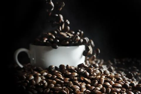 Cup with coffee beans Stock Photos