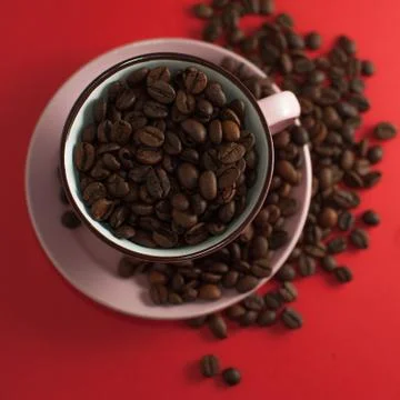 Cup of coffee beans Stock Photos
