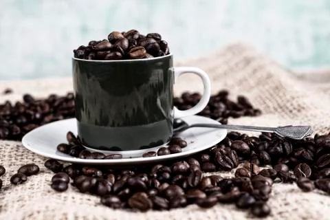Cup with coffee beans Stock Photos