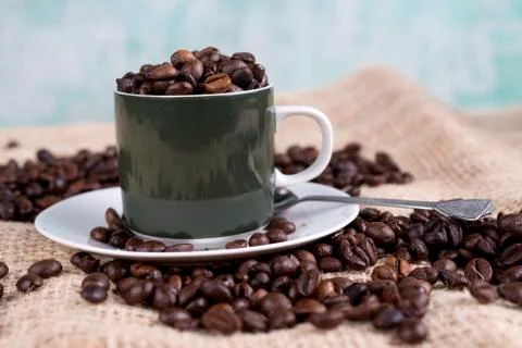 Cup with coffee beans Stock Photos