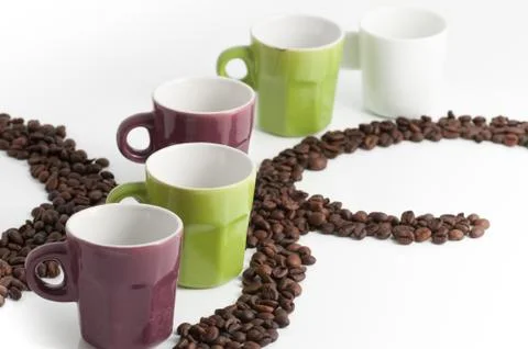 Cup of coffee with beans Stock Photos