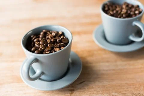 Cup of coffee beans Stock Photos