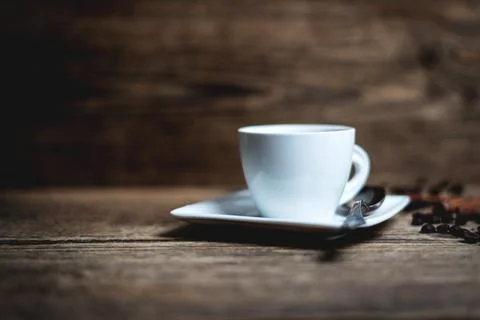 Cup with coffee beans Stock Photos