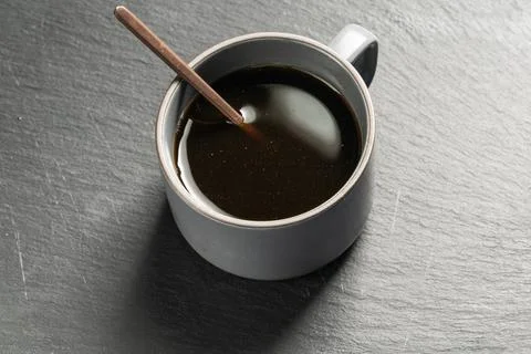 Cup of coffee with beans Stock Photos