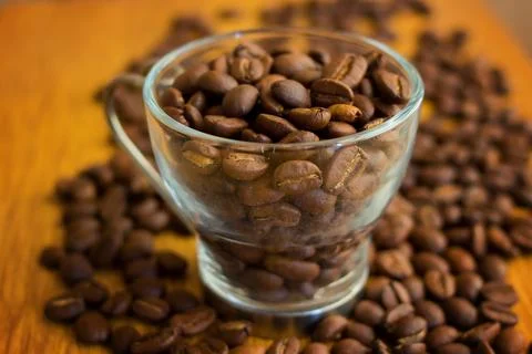 Cup with coffee beans Stock Photos