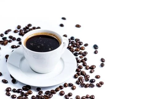 Cup with coffee beans on white background Stock Photos