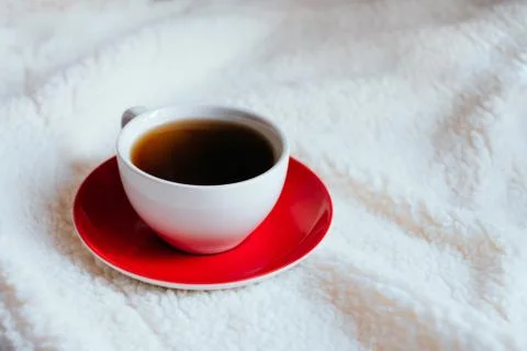 Cup of coffee in bed Stock Photos