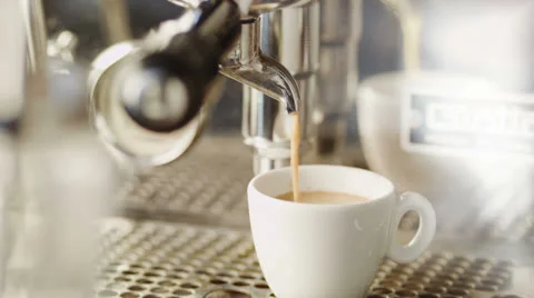 Cup of Coffee Being Poured from a Professional Espresso Machine. 4K Stock Footage 26436735