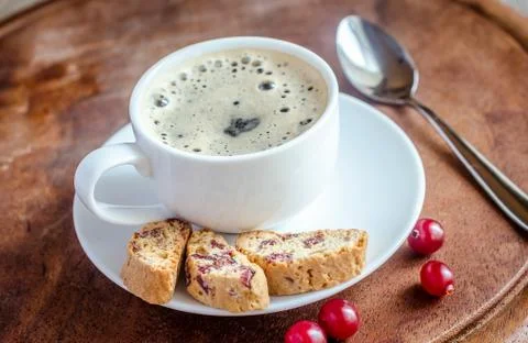 A cup of coffee with biscotti Stock Photos