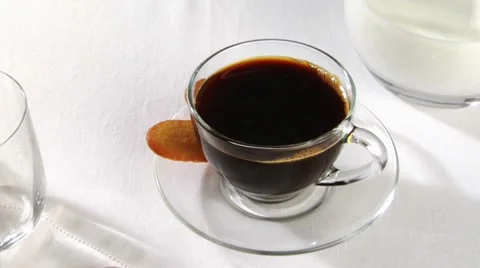 A cup of coffee with biscuits Stock Footage 8571114