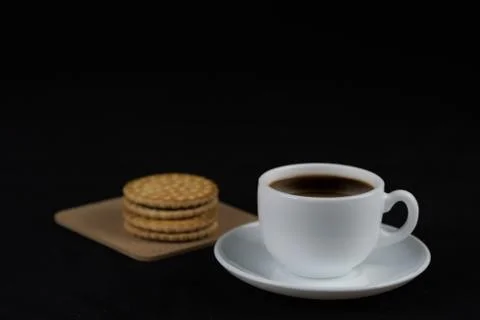 Cup of coffee with biscuits Stock Photos