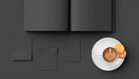 Cup of coffee on a black background close-up next to a notebook Illustrazione stock