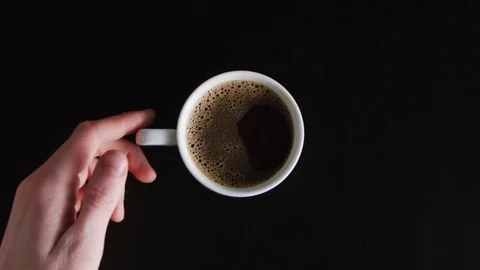 Cup of coffee on a black background Video stock 83166690