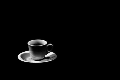 Cup of coffee on black background Stock Photos