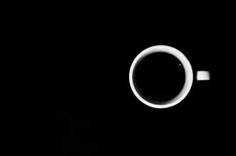 Cup of coffee on black background Stock Photos