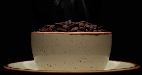 A  cup of coffee on a black background spinning Stock Footage 221188504