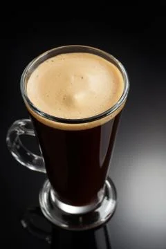 Cup of coffee on black Stock Photos