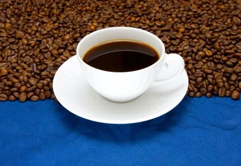 Cup of  coffee on a blue background Stock Photos