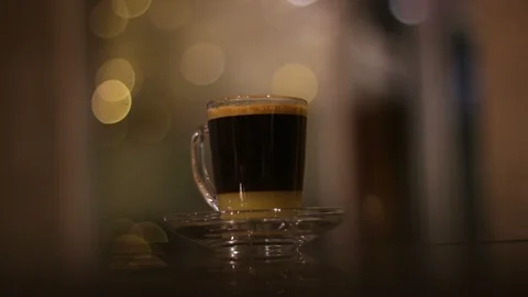 A cup of coffee with blurred background Stock Footage 125928898